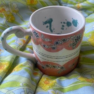 Anthropologie Comedy of Manners Orange Scalloped mug, green interior splatter